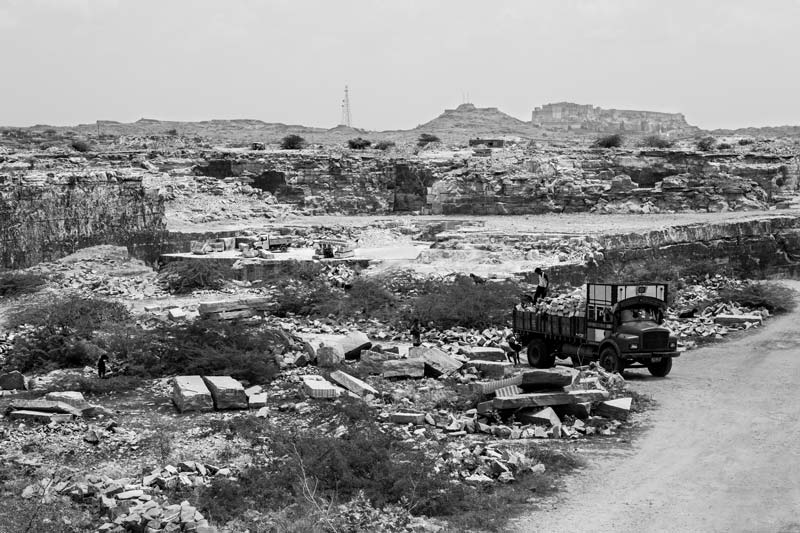A sandstone quarry in Jodhpur  district, Rajasthan - impact of the economically valuable stone quarrying on nature include loss of forest  cover; damage to landscapes; damage to canals, streams and underground aquifers; and deterioration of water quality